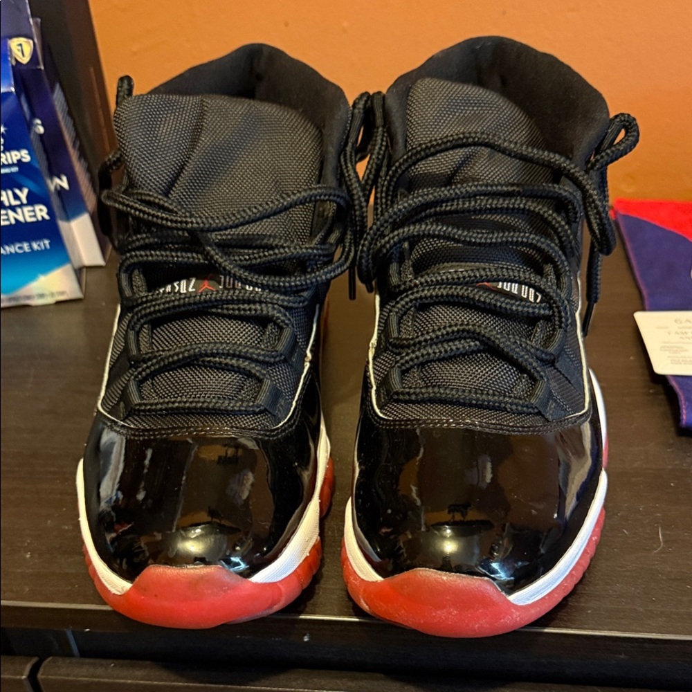 Bred 11 Jordans Black and Red Sneakers